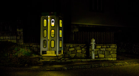 night telephone booth. mystical and mysterious street phone. dangerous place on an empty streetの写真素材