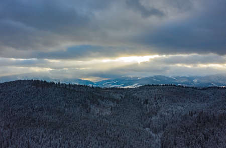 heavenly rays in a mountain forest. beautiful sunset in the mountains. the rays of the sun shine...