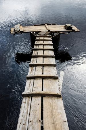 Wooden bridge on the river.の写真素材