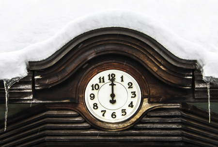 Old street clock. Snow.の写真素材