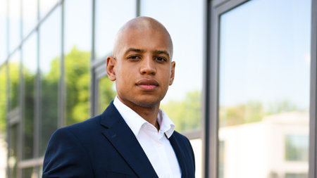African american manager in suit looking at camera outdoorsの写真素材