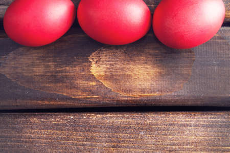 Easter eggs on old dark wood.Selective focus.Space for textの写真素材