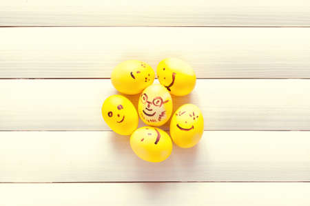 Funny eggs sitting in the tray.Easter eggs.Easter 2015.Eggs smilies.Toning in a warm color.