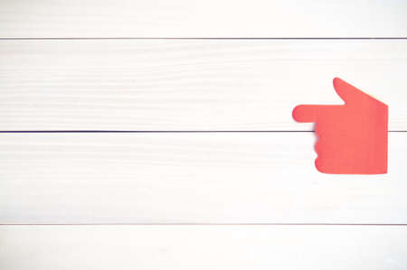 Stickers in the shape of a hand on a wooden background.Sticker hand.Background from boards.の写真素材