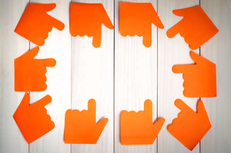 Stickers in the shape of a hand on a wooden background.Sticker hand.Background from boards.の写真素材