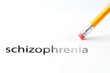 Closeup of pencil eraser and black schizophrenia text. Schizophrenia. Pencil with eraser.の写真素材