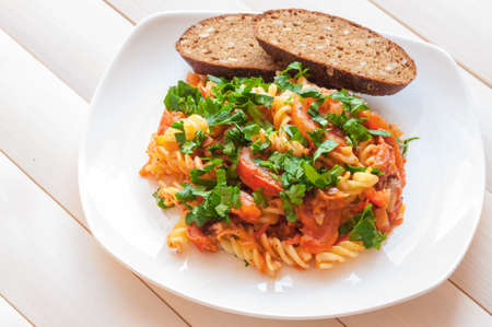 Tomato spaghetti sauce.Grain bread.Healthy food.の写真素材