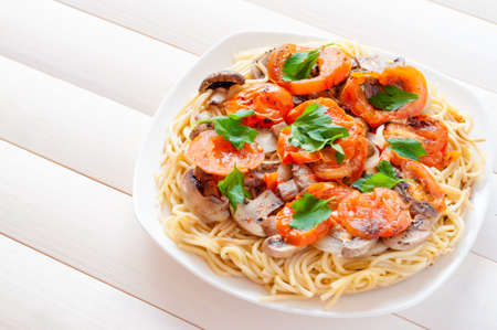 Pizza spaghetti.Pizza.Pizza of spaghetti with tomato and mushrooms, flavored with herbs.の写真素材