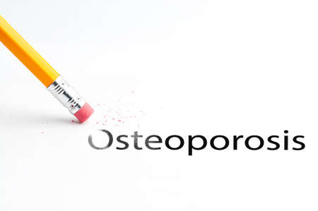 Closeup of pencil eraser and black osteoporosis text. Osteoporosis. Pencil with eraser.の写真素材