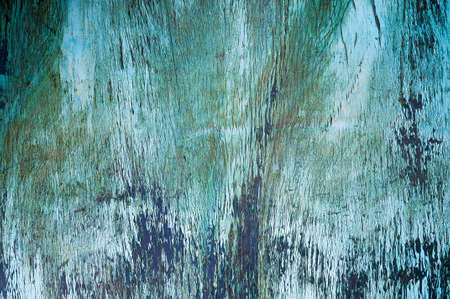 Photo of old painted boards with damaged paint.の写真素材