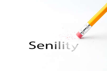 Closeup of pencil eraser and black senility text. Senility. Pencil with eraser.の写真素材