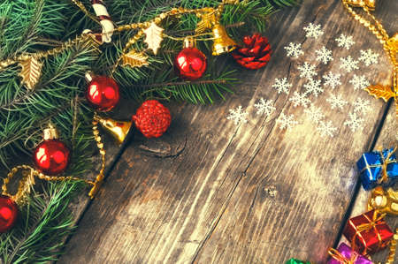 Branches of a Christmas tree on old boards. Christmas background. New Year background. Xmax background.の写真素材