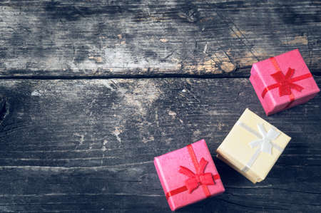 Boxes for gifts on old boards. Christmas background. Christmas decorations. New Year background. Xmax background. Holiday background. Toned image.の写真素材