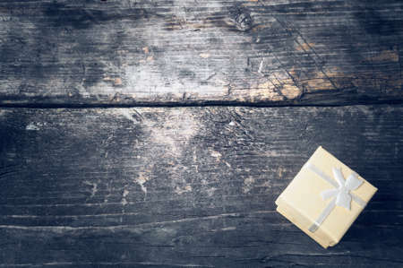 Boxes for gifts on old boards. Christmas background. Christmas decorations. New Year background. Xmax background. Holiday background. Toned image.の写真素材