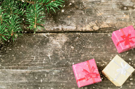 Branches of a Christmas tree on old boards. Christmas background. Christmas decorations. New Year...