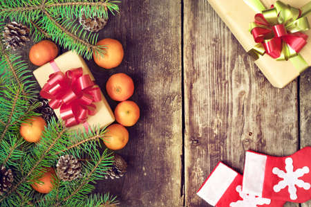 Branches of a Christmas tree on old boards. Christmas background. Christmas Socks. Christmas decorations. New Year background. Xmax background. Toned image.の写真素材