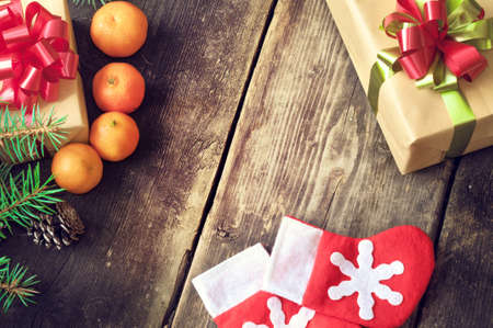 Branches of a Christmas tree on old boards. Christmas background. Christmas Socks. Christmas decorations. New Year background. Xmax background. Toned image.の写真素材