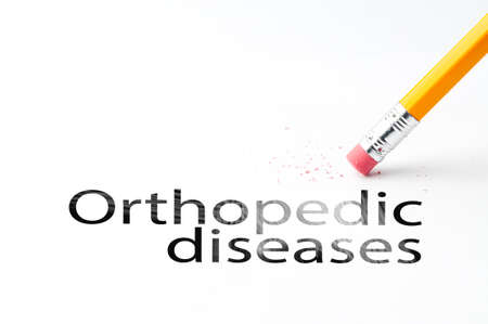 Closeup of pencil eraser and black orthopedic diseases text. Orthopedic diseases. Pencil with eraser.の写真素材