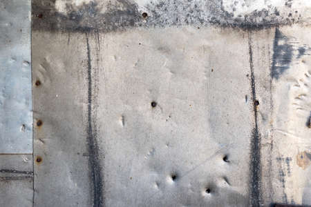 Background of old metal sheets. Metal sheets nailed.の写真素材