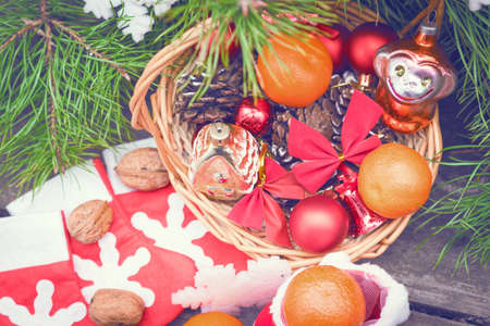 Branches of a Christmas tree on old boards. Christmas background. Christmas Socks. Christmas...