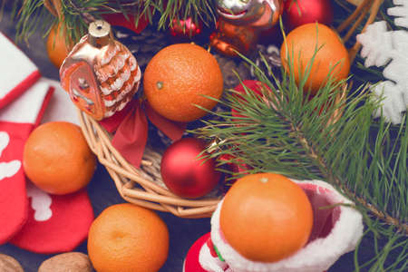Branches of a Christmas tree on old boards. Christmas background. Christmas Socks. Christmas decorations. New Year background. Xmax background. Toned image.の写真素材