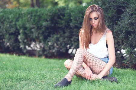 Young girl in fashionable clothes outdoors