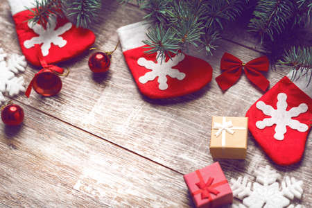 Christmas decorations on old boards. Christmas background. Christmas Socks. New Year background. Xmax background. Christmas tree. Toned image.の写真素材