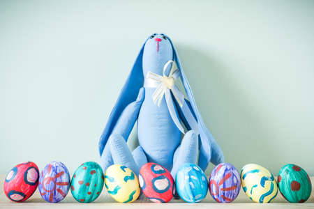 Easter bunnies on a wooden tableの写真素材