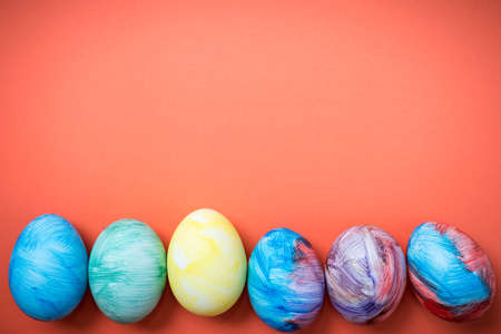Easter eggs on a Living Coral background. 2019. Easter ideas. Easter eggs. Space for text. Happy...