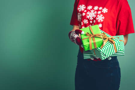 Girl holding a boxes with a gift for Christmas 2019.の写真素材