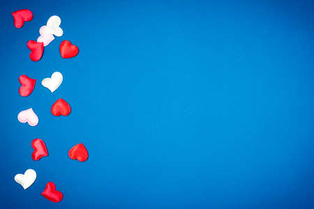 Red heart for Valentine's Day on a beautiful blue background. Heart pendant. Space for text. Red heart. Valentine Day.の写真素材