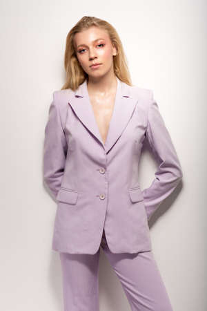 Young girl in a lilac business suitの写真素材