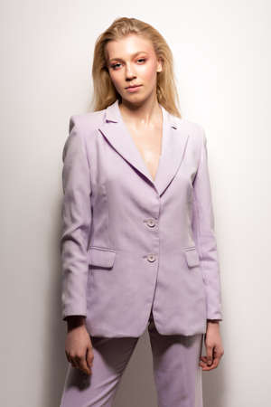Young girl in a lilac business suitの写真素材