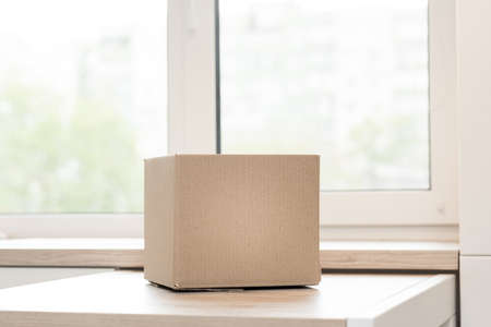 Donation box with food on a light interior background.