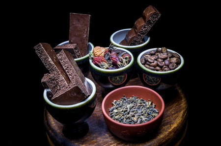 Close-up of dishes with grains, slices of chocolate, fruitsの写真素材