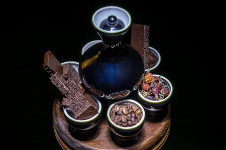 Close-up of dishes with grains, slices of chocolate, fruits