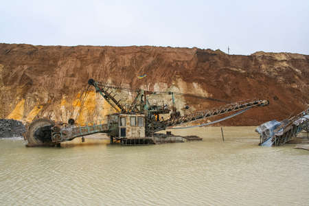 Clay quarry near the town of Polohy in the Zaporizhya region of Ukraine. Rotary excavator, for the extraction of clay flooded by torrential rains. March 2006の写真素材