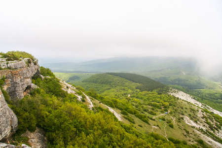 The ruins of the fortress Mangpp (Mangup-Kale, Crimean-Tat. Mangup, Mangup) - a medieval fortress city in the Bakhchsarai district of the Crimea. The historical name is Baba-Dag, Father-Mountain. The capital of the principality Theodoro (Crimean Gothia), の写真素材