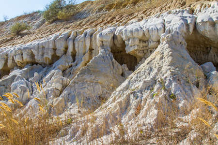 Bizarre figures carved in clay sands in an old quarry. Zaporozhye region, Ukraine. September 2017のeditorial素材