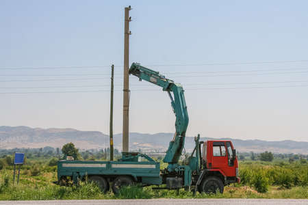 Mounting of an electric support with a crane manipulator on the outskirts of the town of Denizli....