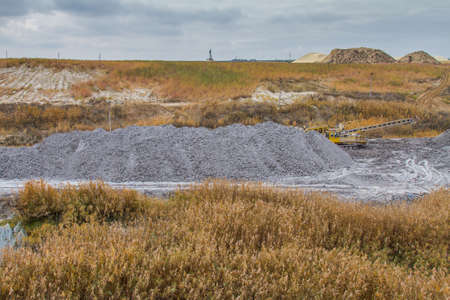 A powerful dragline excavator works in a clay quarry in the Zaporozhye region of Ukraine. November...