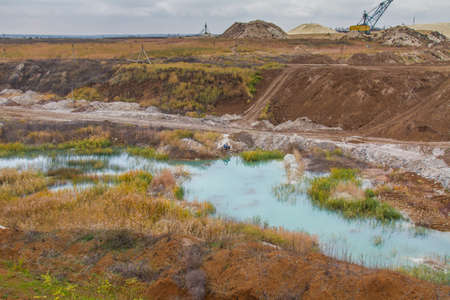 A powerful dragline excavator works in a clay quarry in the Zaporozhye region of Ukraine. November...