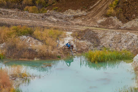 A powerful dragline excavator works in a clay quarry in the Zaporozhye region of Ukraine. November...
