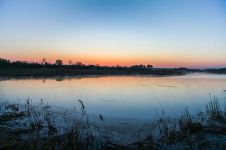 morning mist over the water in the Ukrainian steppe. Zaporozhye region, Ukraine. April 2004の写真素材