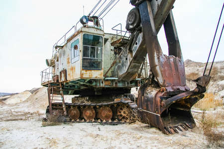 Old but working electric excavator caterpillar reverse mechanical shovel in the clay quarry in the Zaporozhye region. Ukraine.の写真素材