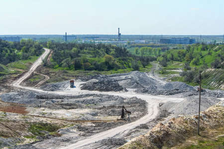 Rotary excavator in kaolin quarry. Zaporozhye region, Ukraine. November 2012