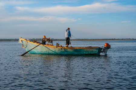 Fishermen earn their living by fishing in the Dnipro River. The coast near the village of Kushugum,...
