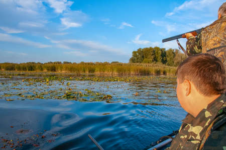 Hunters hunt ducks in the Kushugum floodplains on the Dnipro River. Zaporizhzhya region, Ukraine....