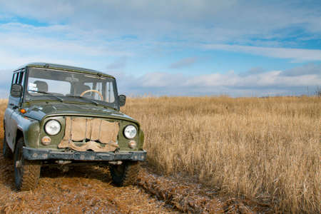 Lone all-terrain vehicle on a country road. Off-road car. Zaporizhzhya region, Ukraine. January 2016の写真素材