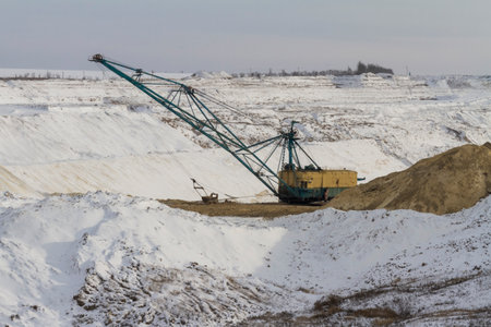 A walking dragline excavator performs overburden stripping in a clay pit. Zaporizhia region,...